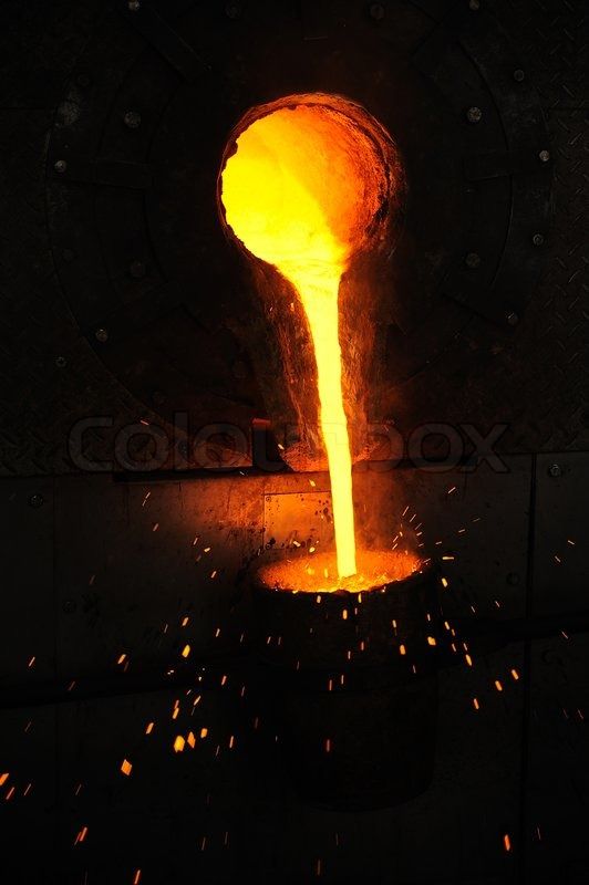 Molten metal glowing as it is poured